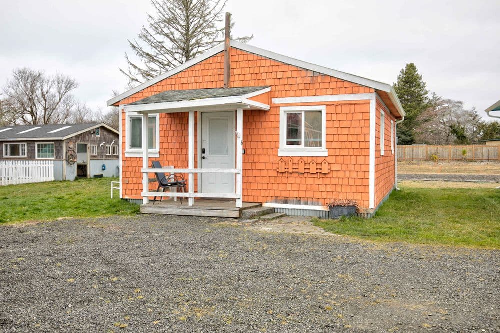 Cottage 6 exterior — warm coral shingle cottage